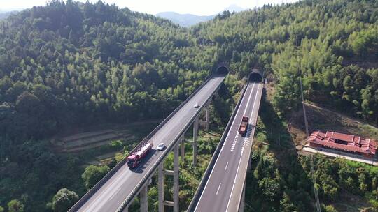 高速公路汽车进出隧道航拍高架桥货车高速路视频素材模板下载