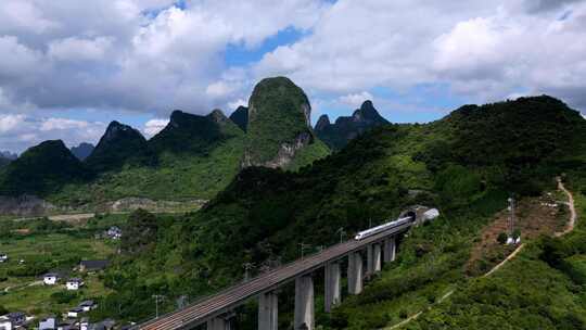 航拍山谷隧道中驶出的高铁列车视频素材模板下载