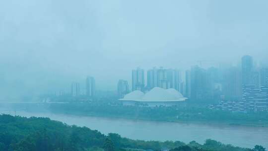 南宁五象新区城市高楼建筑与邕江雨雾缭绕