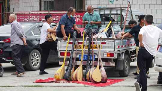 新疆街头弹唱视频素材模板下载