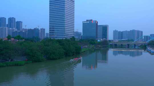 广州南沙城市摩天大楼与蕉门河划龙舟