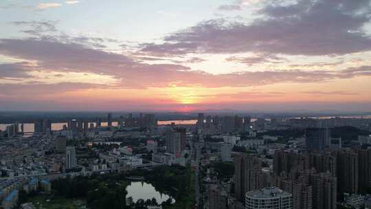 夏日晚霞下单轨列车穿行芜湖主城航拍素材