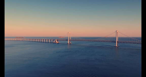 大连航拍海边跨海湾大桥唯美岩壁大海夕阳