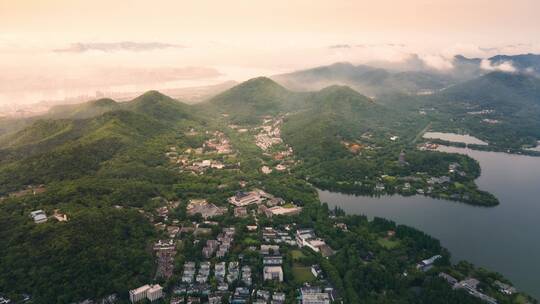 日出时分杭州西湖群山云雾航拍大范围延时