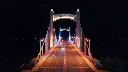 航拍夜景大桥穿越桥面七彩绚丽灯光汽车过桥