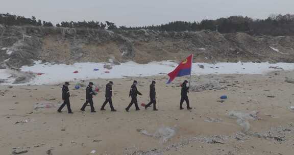 航拍山东威海海岸警察高举警旗巡逻踏查海岸