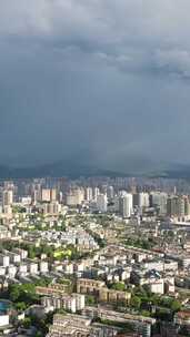 竖版航拍城市暴雨来临高楼雨季