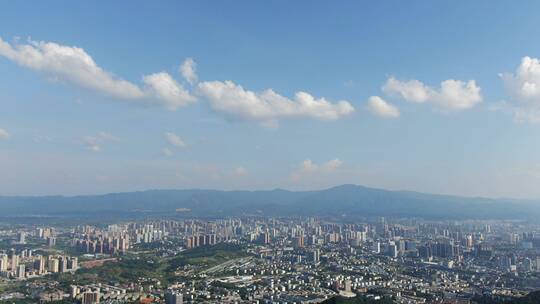 航拍山川丘陵城市蓝天白云