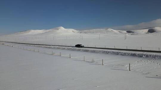 冬季雪天内蒙乌兰布统塞罕坝草原公路4K航拍视频素材模板下载