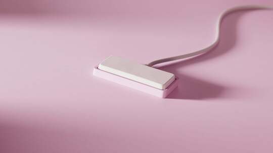 粉色背景白色电子产品特写