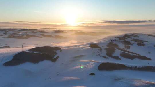 雪后极寒丘陵雪原灿烂夕阳