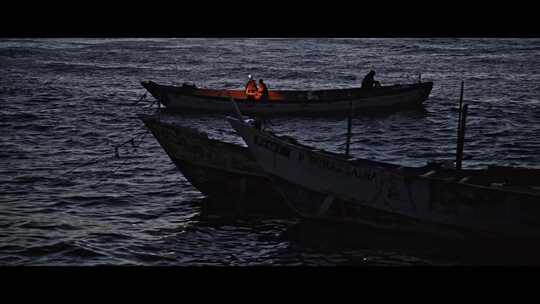 FPV无人机航拍渔民夜晚在渔船上捕鱼工作
