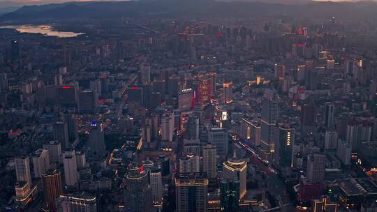 汇都国际楼顶航拍华灯初上时的昆明城市风光视频素材模板下载