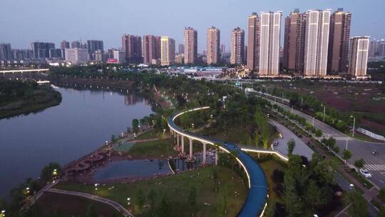 航拍湖南衡阳陆家新区城市夜景人行观光桥