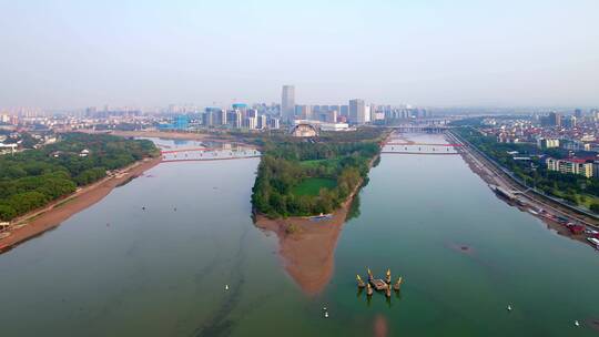 航拍夕阳金华城区江五百滩公园现代城市风光