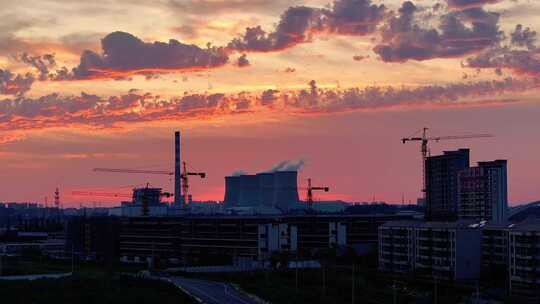 航拍火力发电厂夕阳火烧云楼层建筑施工地