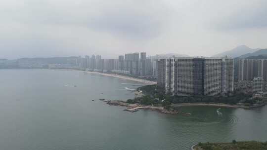 航拍惠州十里银滩沙滩和高楼建筑群