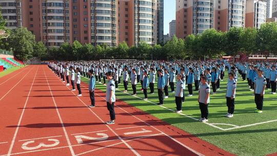 航拍学校高中生学生操场做操运动会视频素材模板下载