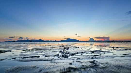 4k航拍日落晚霞后的滩涂海天一色