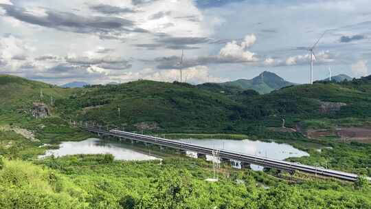 航拍中国高铁驶过山川与乡村