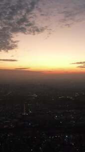 竖版航拍城市夕阳晚霞日落火烧云