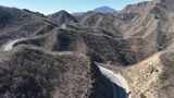 航拍山间蜿蜒公路高清在线视频素材下载