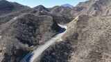 航拍山间蜿蜒公路高清在线视频素材下载