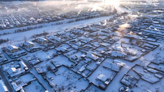 航拍寒冬黎明森林小镇雪景