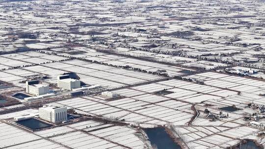 航拍乡镇雪景学校建筑田地大桥别墅河流房屋