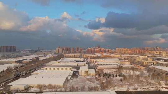 冬季航拍烟台大雪后的城市建筑和晚霞风景