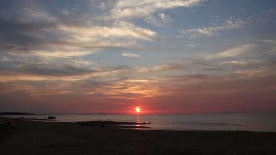 威海市环翠区金海路沙滩大海夕阳晚霞天空