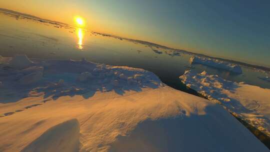 FPV航拍冰山冰川日出阳光照射大海冰川