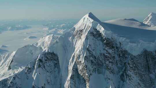 航拍新疆大雪山云雾缭绕雪景旅游视频素材模板下载