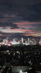 竖屏航拍城市晚霞夜景广西玉林夜景