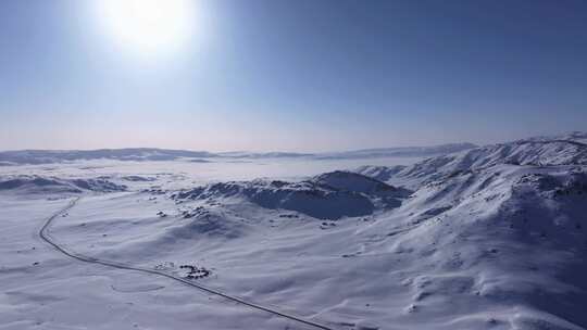 航拍新疆阿勒泰雪景吉木乃草原石城输电线路