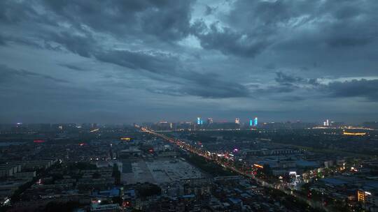 城市航拍洛阳阴雨天后城市云海夜景建筑