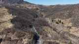航拍蜿蜒盘旋的山间公路高清在线视频素材下载