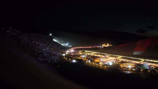 敦煌市月牙泉夜晚场地灯光秀空中俯拍画面
