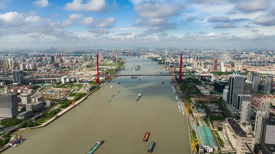 俯瞰越过上海杨浦大桥-航拍延时浦江两岸