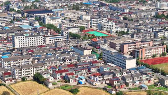 航拍农村乡镇建筑学校河湖稻田房屋视频素材模板下载