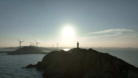 海上灯塔航拍海洋风车发电大海日出阳光海面
