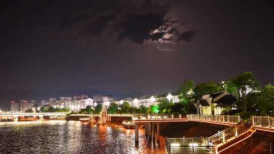 河畔夜景建筑与水车景观