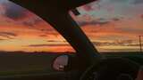 驾驶室看窗外黄昏夕阳，后视镜风景高清在线视频素材下载