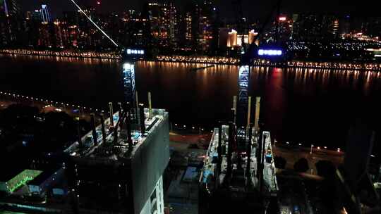 航拍广州琶洲腾讯微信大楼的建设夜景