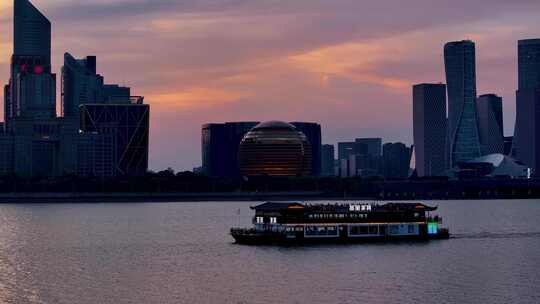 CBD城市高楼大厦杭州钱塘江晚霞游船夜景