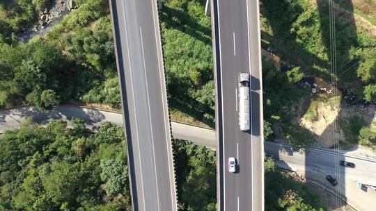 航拍高速公路上行驶的货车汽车高架桥高速路视频素材模板下载