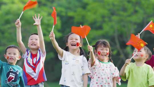 国庆节中国梦小孩草坪摇旗子祝福祖国儿童节