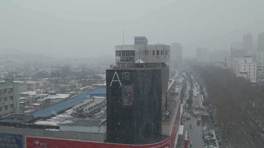 河南省南阳市红都百货A馆冬季雪景环绕航拍