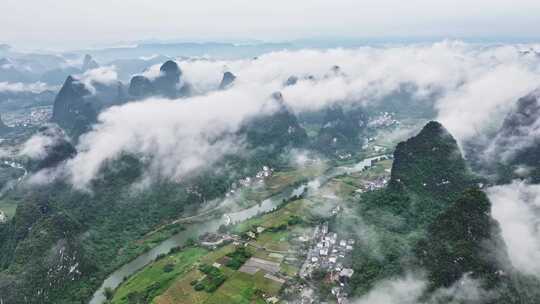 航拍桂林云海下的山峰