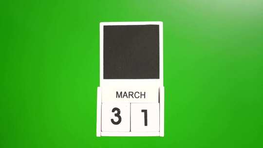 03.绿色背景上日期为3月31日的日历。视频素材模板下载